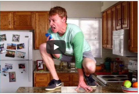 How Much Does it Cost to Start an Insurance Agency? 20 Video of a man kneeling on his kitchen counter screaming.